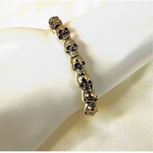 Gold tone skull cord adjustable bracelet